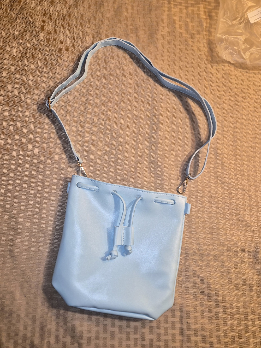 light blue faux leather drawstring bucket bag